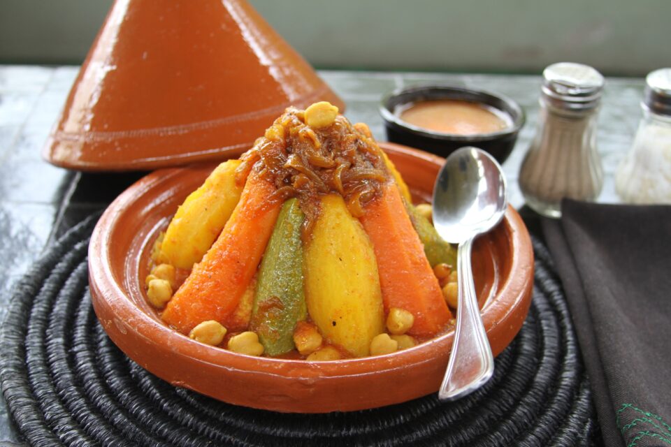 Traditional Moroccan tagine clay pot stew served with aromatic spices and fresh ingredients